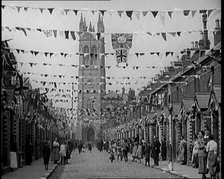 People Out the Front of Their Houses in a Street Decorated With Union Flag Bunting in Belfast, 1921. Creator: British Pathe Ltd.