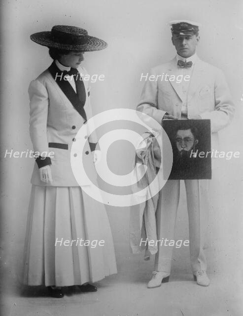 Paula Marr and Wm. Collier holding picture, 1910. Creator: Bain News Service.