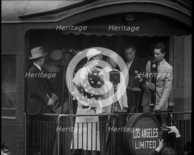 Aimee Semple McPherson Conducting a Crowd in Singing a Hymn, 1930s. Creator: British Pathe Ltd.
