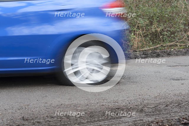 Pot holes in road surface 2017. Creator: Unknown.