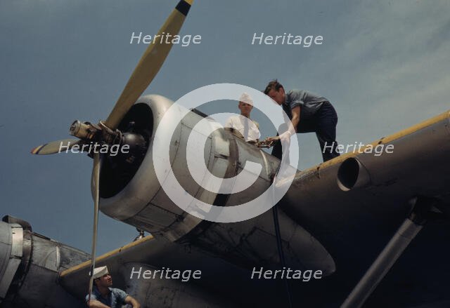 Fueling a plane at the Naval Air Base, Corpus Christi, Texas, 1942. Creator: Howard Hollem.