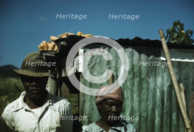 FSA - Tenant Purchase borrower? in front of their house, Puerto Rico, 1941 or 1942. Creator: Jack Delano.