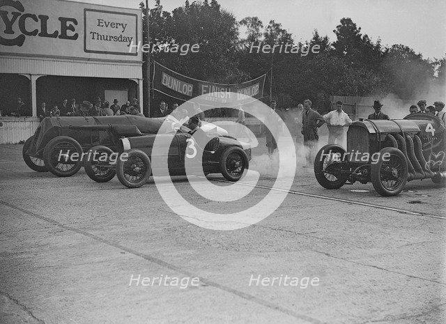 Fiat, Bugatti and Benz competing at a Surbiton Motor Club race meeting, Brooklands, Surrey, 1928. Artist: Bill Brunell.