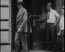 Alcohol Smugglers Coming Out of Court, 1929. Creator: British Pathe Ltd.