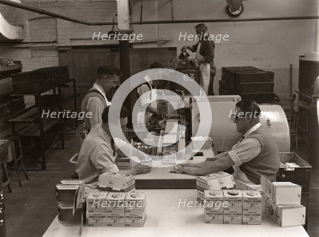 Men wrapping Rowntree's Fruit Gums and packing into boxes, Rowntree factory, York, Yorkshire, 1955. Artist: Unknown