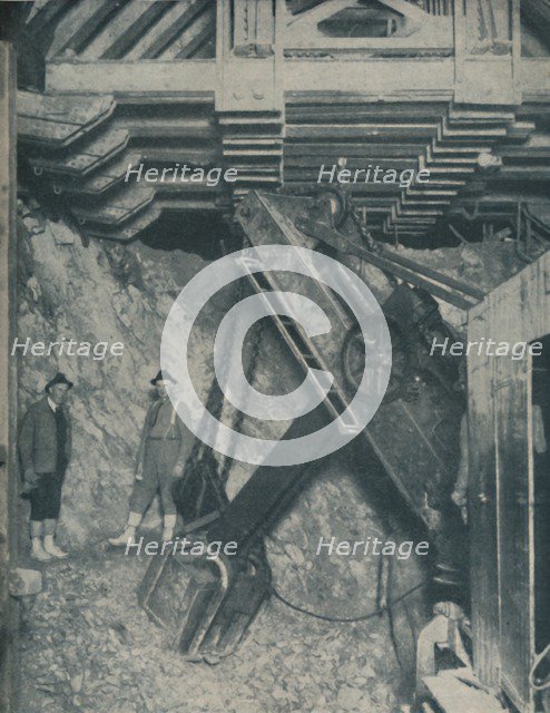 'Clawing Out the Heart of a Mountain for a Colorado City Tunnel', c1935. Artist: Unknown.