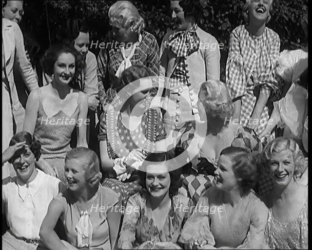 A Large Group of Female Civilians Posing for Photos, 1931. Creator: British Pathe Ltd.