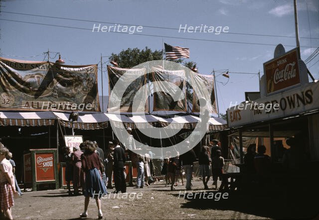 Barker at the grounds of the Vermont state fair, Rutland, 1941. Creator: Jack Delano.