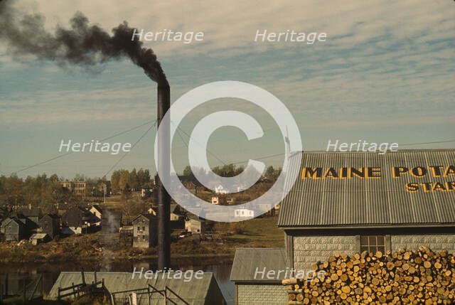 A starch factory along the Aroostook River, Caribou, Aroostook County, Maine., 1940. Creator: Jack Delano.