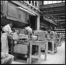 Operating jiggers in a pottery works, Stoke-on-Trent, 1965-1968. Creator: Eileen Deste.