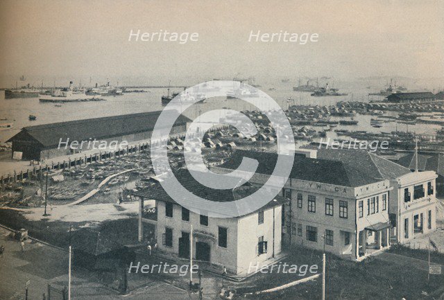 'Singapore Harbour is always crowded with shipping of many type and nationalities', 1937. Artist: Unknown.