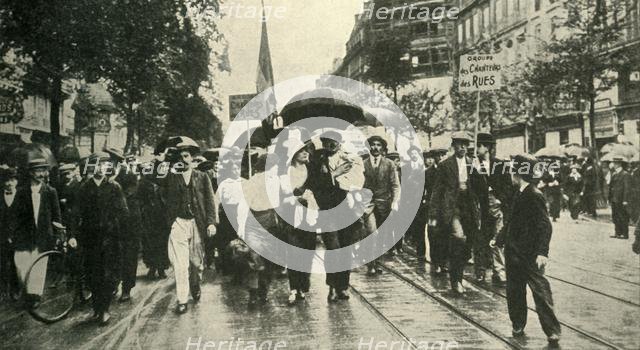 'The French Call to Arms: Reservists joining the Colours in Paris', c1914, (c1920).  Creator: Unknown.