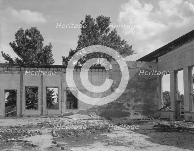 Some of the walls of the bank still stand at Fullerton, Louisiana, abandoned lumber town, 1937. Creator: Dorothea Lange.