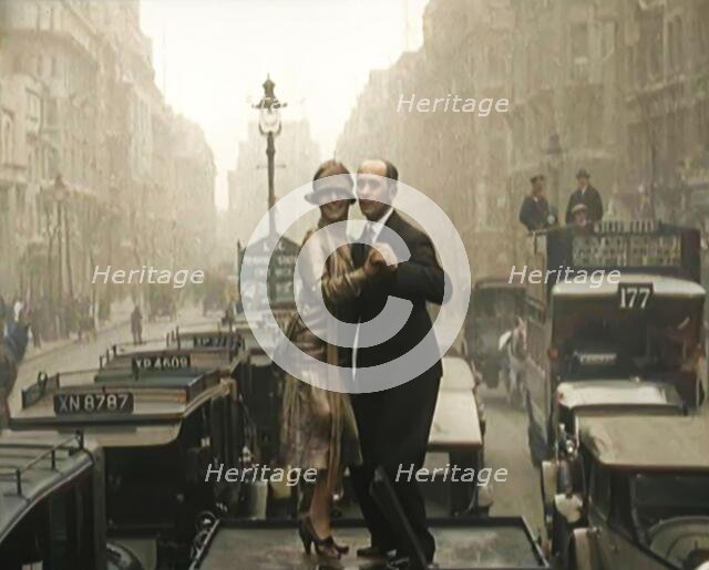 A Couple Dancing the Charleston on the Top of a Car Driving Down a London Street, 1926. Creator: British Pathe Ltd.
