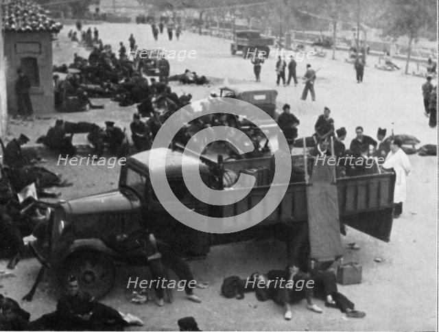 Spanish Civil War 1936-39. Madrid, Red Cross post with doctors and nurses, in a city street, Dece…