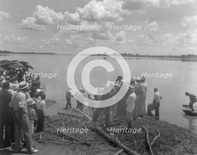 Baptism by immersion in the MIssissippi River, May 29, 1938: ankle-deep in water. Creator: Frances Benjamin Johnston.