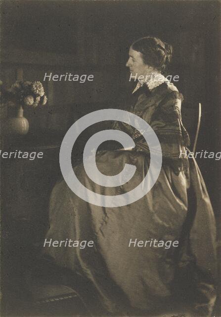 Self-portrait with Table and Flowers, 1896-1899. Creator: Gertrude Kasebier.
