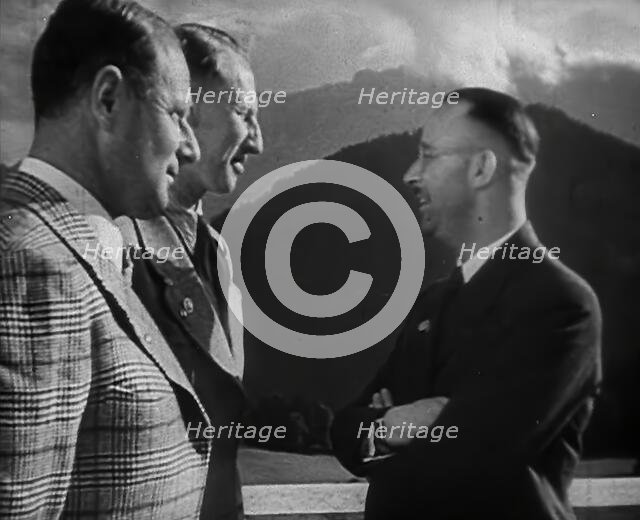 Heinrich Himmler Talking to Two Other Men, 1942. Creator: British Pathe Ltd.