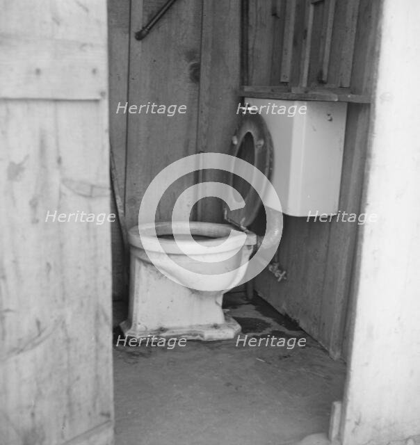 Toilet for ten cabins, men, women...in auto camp..., Greenfield, Salinas Valley, CA, 1939. Creator: Dorothea Lange.