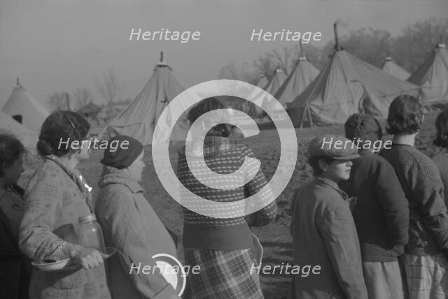 Possibly: Refugees lined up at meal time in the camp for white flood...Forest City, Arkansas, 1937. Creator: Walker Evans.