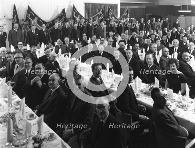 Members of the Royal Army Ordnance Corps (RAOC) gather for their annual dinner, 1965. Artist: Michael Walters