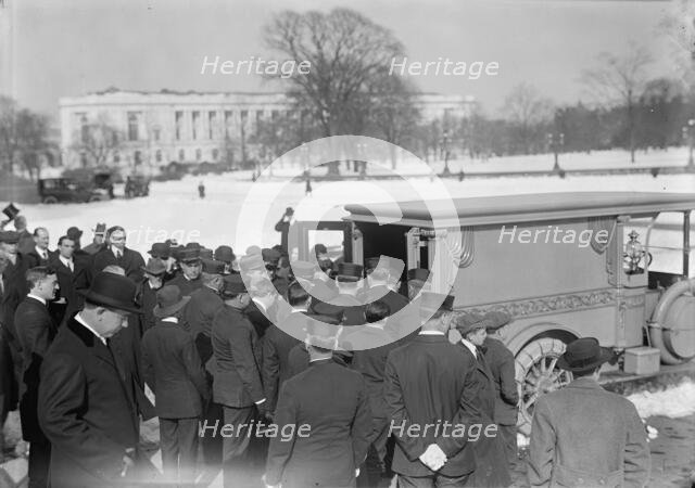 U.S. Capitol - Visitors, Etc., Casket Being Placed In Hearse, 1914. Creator: Harris & Ewing.