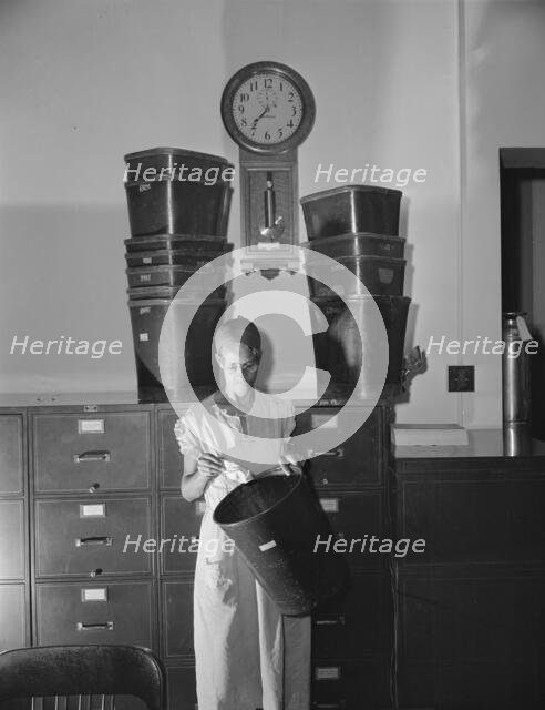 Government charwoman who provides for a family of six on her salary..., Washington, D.C., 1942. Creator: Gordon Parks.