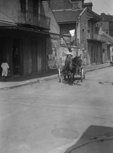 Street scene in the French Quarter, New Orleans, between 1920 and 1926. Creator: Arnold Genthe.
