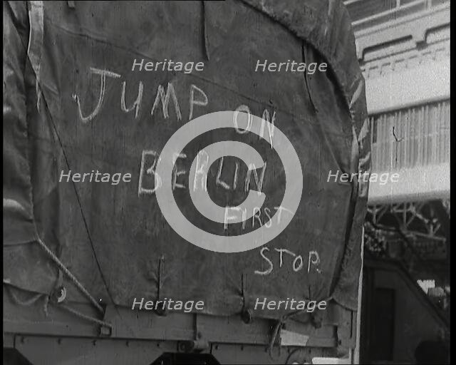 Chalk Graffiti on the Tarpaulin Covering a Lorry Reading 'JUMP on BERLIN FIRST STOP', 1939. Creator: British Pathe Ltd.