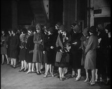 The Producer Julian Wylie Inspecting Young Prospective Female Stage Performers Standing..., 1920s. Creator: British Pathe Ltd.