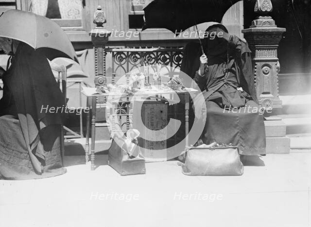 Outside church of St. Jean Baptiste, selling beads, etc., between c1910 and c1915. Creator: Bain News Service.