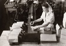Woman packing Kit Kat into boxes, Rowntree factory, York, Yorkshire, 1949. Artist: Unknown