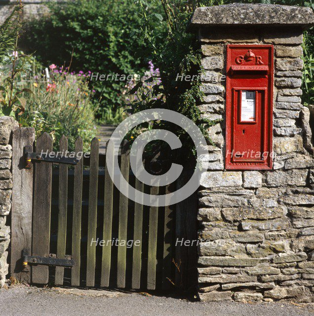 Wall-mounted post box and wooden gate, Upper Slaughter, Cotswolds, Gloucestershire, c2000s(?). Artist: Unknown.
