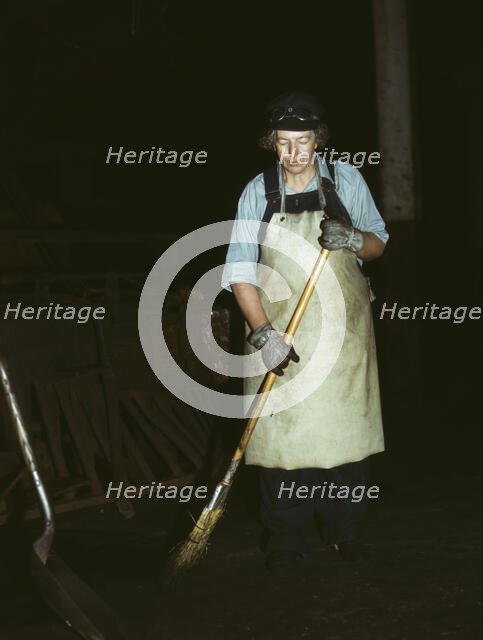C. & N.W. R.R., Mrs. Elibia Siematter, working as a sweeper at the roundhouse, Clinton, Iowa, 1943. Creator: Jack Delano.
