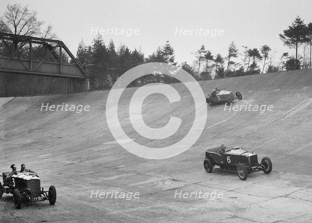 Bentley of Major H Butler and Sunbeam of BO Davis racing at a BARC meeting, Brooklands, 1930. Artist: Bill Brunell.