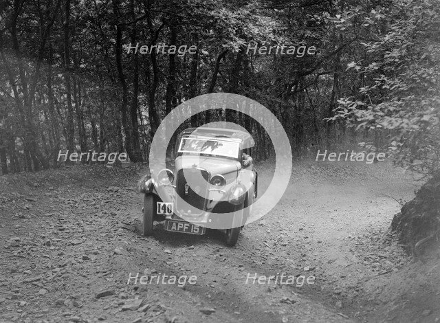 Singer coupe competing in the B&HMC Brighton-Beer Trial, Fingle Bridge Hill, Devon, 1934. Artist: Bill Brunell.