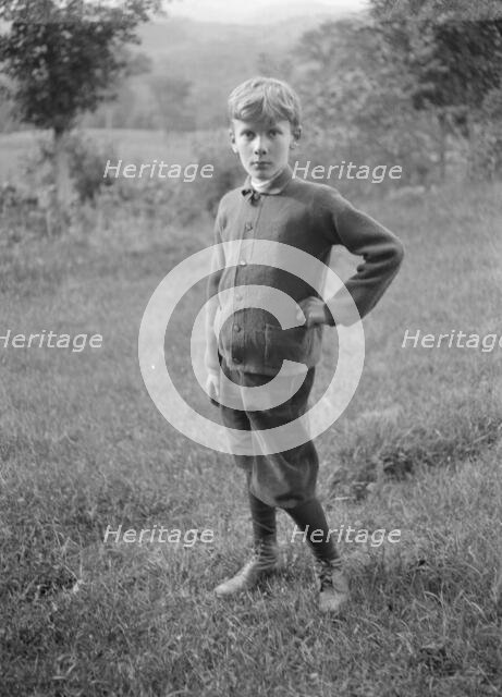 Unidentified child, standing outdoors, between 1896 and 1942. Creator: Arnold Genthe.