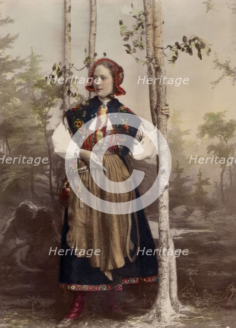 Woman in full figure dressed in costume from Floda parish, Dalarna, 1890-1920.  Creator: Helene Edlund.