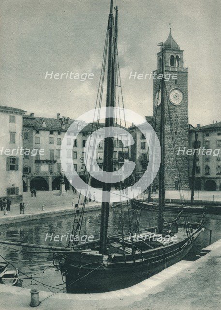 Harbour and Torre Apponale, Riva del Garda, Italy, 1927. Artist: Eugen Poppel.