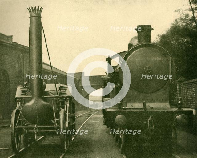 'A full size model of Stephenson's Rocket alongside an engine of the "George the Fifth" class, Londo Creator: Unknown.