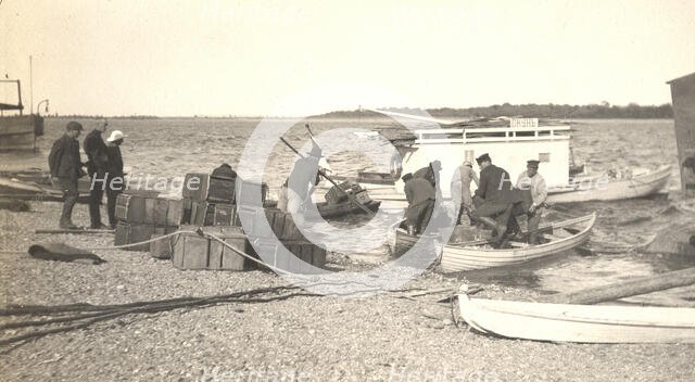 Unloading gasoline from boats on the Zee River during windy conditions, 1909. Creator: Vladimir Ivanovich Fedorov.