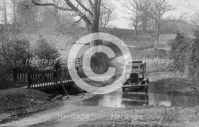 Talbot 75 4-door saloon driving through a ford, c1930.   Artist: Bill Brunell.