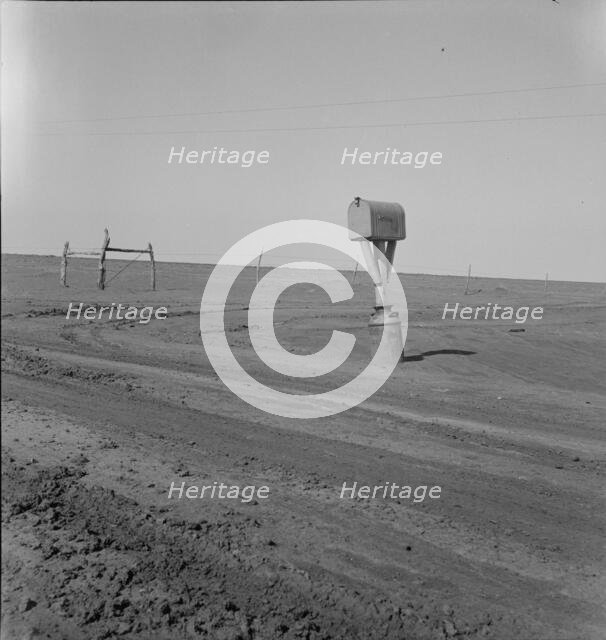 Mailbox in Dust Bowl, Coldwater District, north of Dalhart, Texas, 1938. Creator: Dorothea Lange.