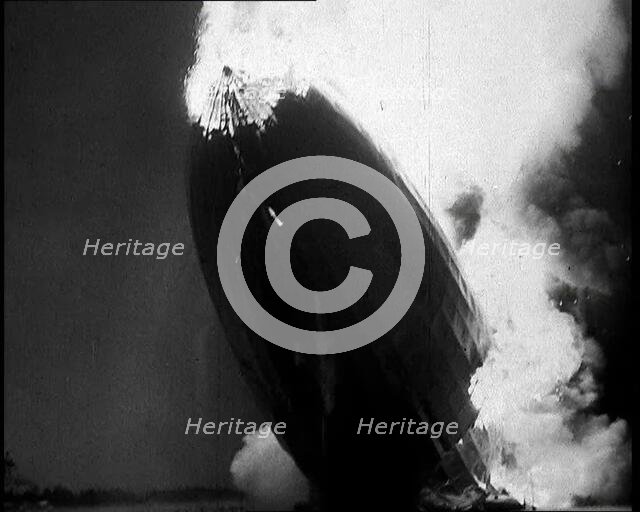 The German Airship, the Hindenburg, its Rear Half Destroyed And Obscured By Smoke With..., 1937. Creator: British Pathe Ltd.