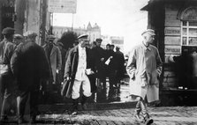Soviet leader Joseph Stalin escorted by GRU secret agents, late 1920s. Artist: Anon