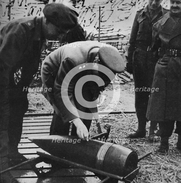 'Mr. Churchill autographing a present for Hitler', c1940s, (1945). Artist: Unknown.