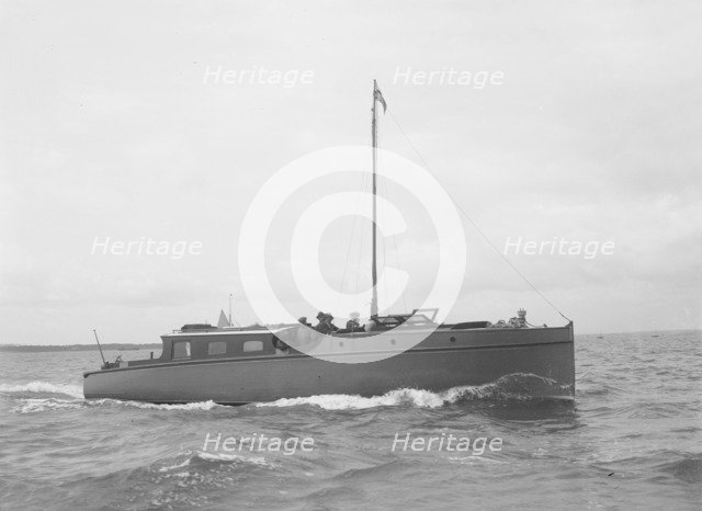 The motor yacht 'Cygnet' under way, 1922. Creator: Kirk & Sons of Cowes.