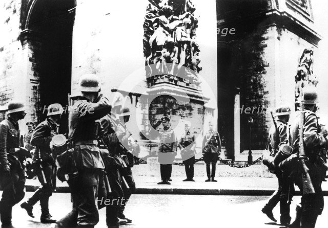 German troops marching past the Arc de Triomphe, Paris, 14 June 1940. Artist: Unknown