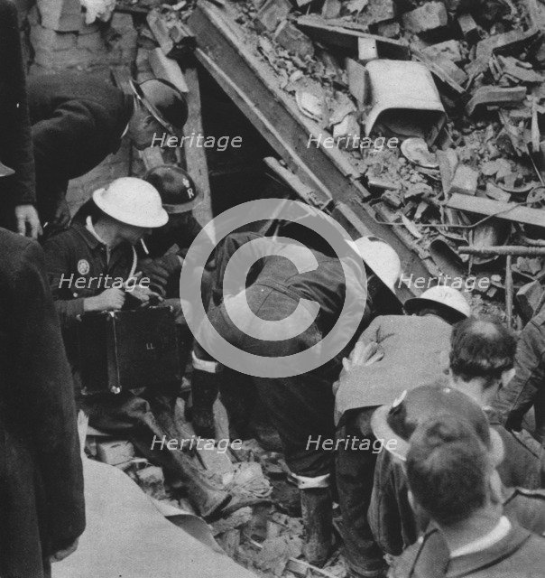 'The search goes on', 1941 (1942). Artist: Unknown.