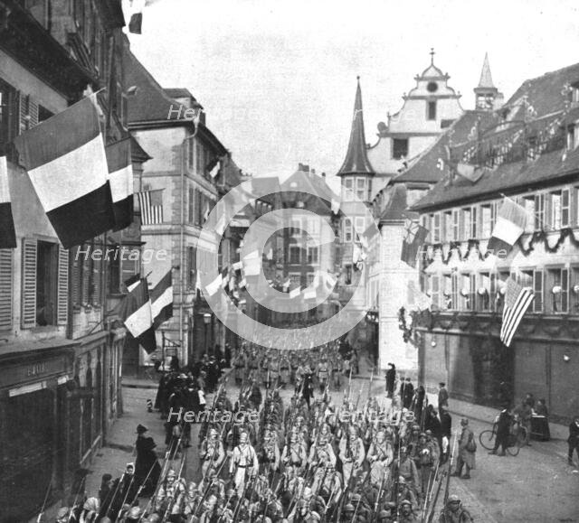 'Notre entrée a Colmar; Le defile des troupes francaises dans les rues...22 novembre 1918. Creator: Unknown.